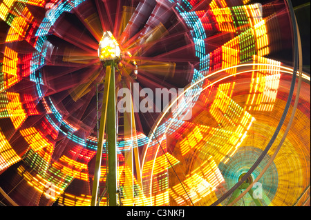 Ferris wheel in motion close up of light streaks Evergreen State Fair Monroe Washington State USA Stock Photo