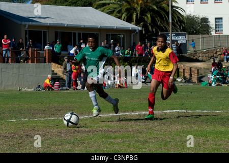 Striker and defender of an U13 football team in a match at Cape Town South Africa Stock Photo
