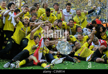 Team Borussia Dortmund present the german football league championship trophy Stock Photo