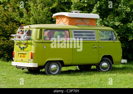 Lime green VW camper van parked in a field. UK Stock Photo