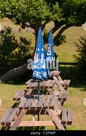 Empty Beer Garden Wooden Benches With Closed Parasols Stock Photo