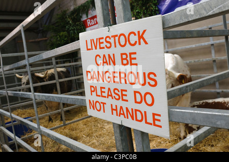 Sign warning that livestock can be dangerous Stock Photo