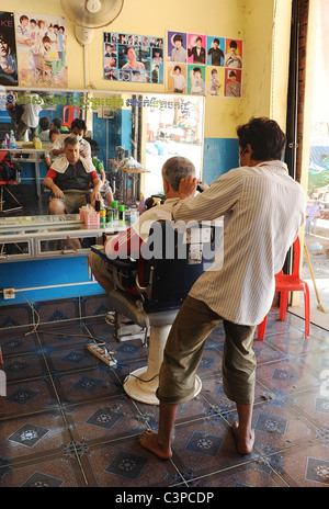 Happy dad carries serious podgy cute son. Stock Photo