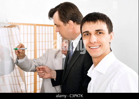 Portrait of a team planning. Office background. Stock Photo