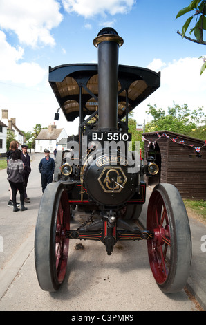 People looking at a Traction Engine at Reach Fair, Reach, Cambridgeshire UK Stock Photo