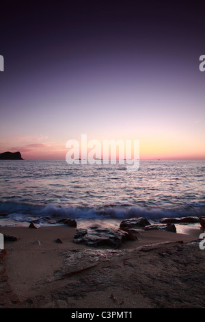 Beach of Cala Conta at sunset, Ibiza, Spain Stock Photo