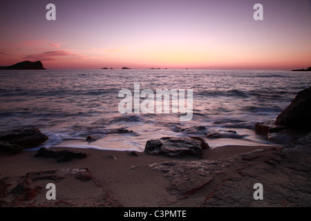 Beach of Cala Conta at sunset, Ibiza, Spain Stock Photo