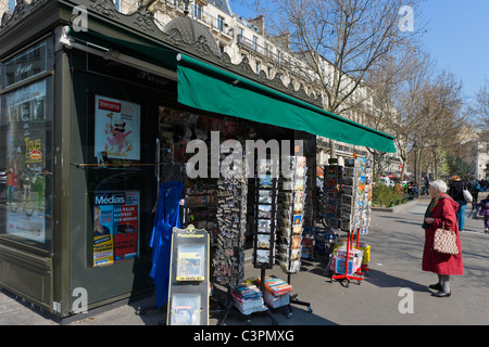 Typical newspaper kiosk on the Boulevard Rochechouart, Montmartre, Paris, France Stock Photo