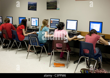 Male and female students do classwork in computer lab at middle school in Pflugerville, Texas USA Stock Photo
