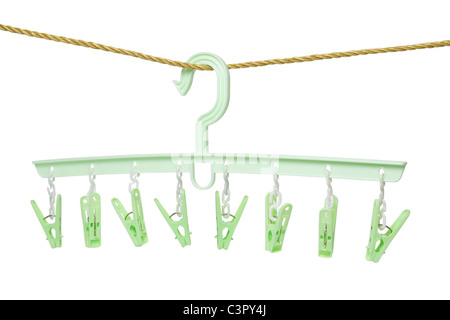 Plastic clothes hanger with hanging pegs on white background Stock Photo