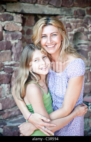 Mother and daughter hug, portrait Stock Photo