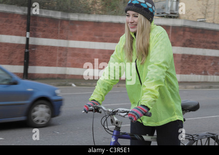 Young woman riding a pushbike Stock Photo