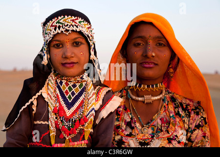 Young woman and little girl smiling in Sam desert, Jaisalmer, Rajasthan, India, Asia Stock Photo