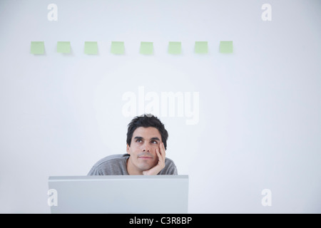 Man thinking at computer Stock Photo