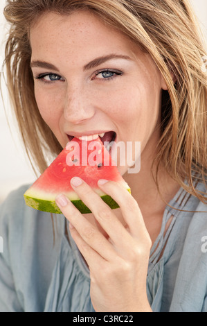Woman eating watermelon Stock Photo
