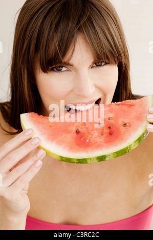 Woman eating watermelon Stock Photo