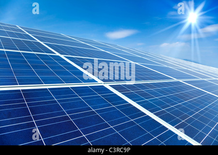 Closeup of Solar Panels with sunlight and blue sky background Stock Photo