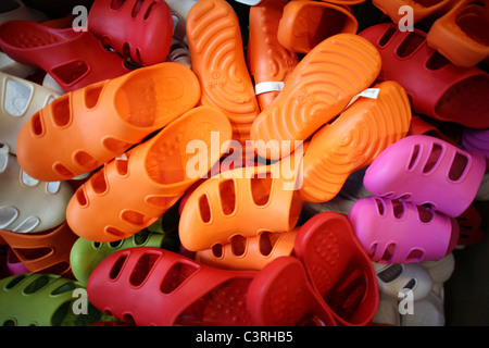 Colourful plastic shoes Stock Photo