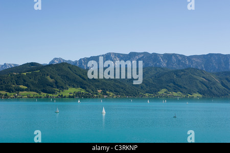 Austria, Salzkammergut, Boats in attersee lake with hoellen mountains in background Stock Photo