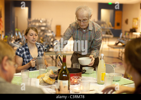 Maundy Thursday observance at St. Martin's Lutheran Church in Austin, Texas, includes simple meal with homemade bread and soup. Stock Photo