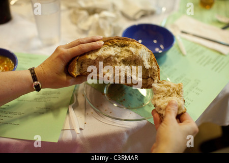 Maundy Thursday observance at St. Martin's Lutheran Church in Austin, Texas, includes simple meal with homemade bread. Stock Photo