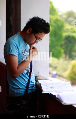 Student reading a book Stock Photo