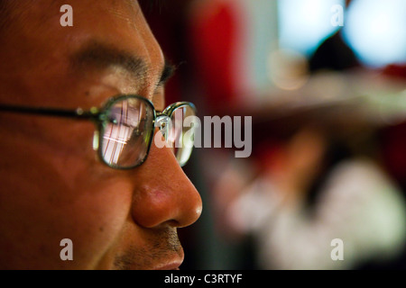 Young Korean American wearing glasses, Manhattan, New York City Stock Photo