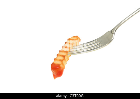 Single crinkle cut potato chip dipped in tomato ketchup on a fork isolated against white Stock Photo