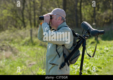 mature male birdwatcher, cley, north norfolk, england Stock Photo