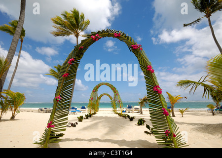 Wedding archway on tropical beach. Stock Photo