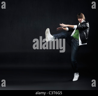 Handsome hip hop dancer jumping Stock Photo