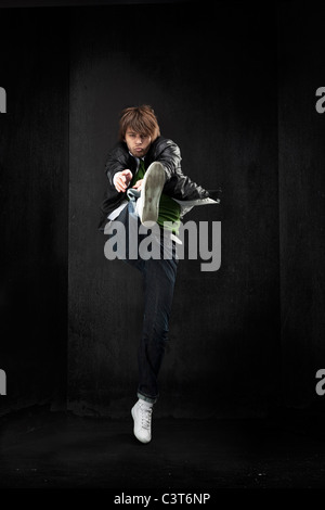 Handsome hip hop dancer jumping Stock Photo