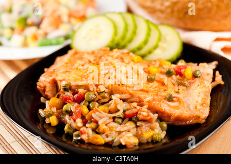 Closeup of salmon fillets served with vegetables garnish Stock Photo