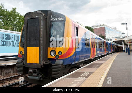 Siemens class 450 desiro train in South West Trains livery waiting at a station platform in England. Stock Photo