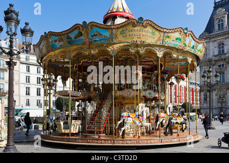 Carousel in front of the Hotel de Ville (Town Hall), 4th Arrondissement, Paris, France Stock Photo
