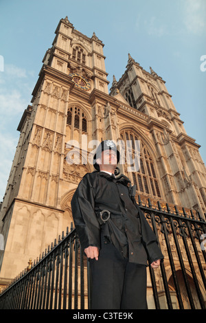 British Metropolitan Police officer standing outside Westminster Abbey the evening before the Royal Wedding, April 2011. Stock Photo