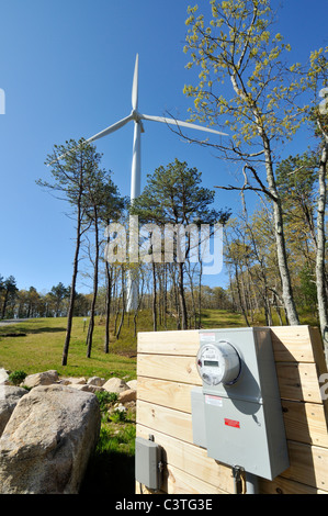 Wind turbine in the landscape with meter measuring power generated by turning blades. USA Stock Photo