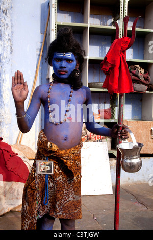 Indian people and daily life during the annual camel fair in Pushkar, Rajasthan, India, Asia. Boy dressed as God Shiva Stock Photo