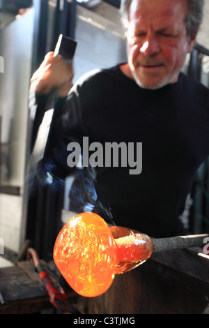 Robert Pierini and his son are both glass blower master. They are modeling artistic pieces into their workshop of Biot Stock Photo