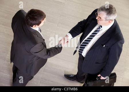 High angle view of two businessmen shaking hands Stock Photo