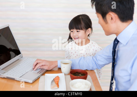 Father and Daughter Having Breakfast Stock Photo