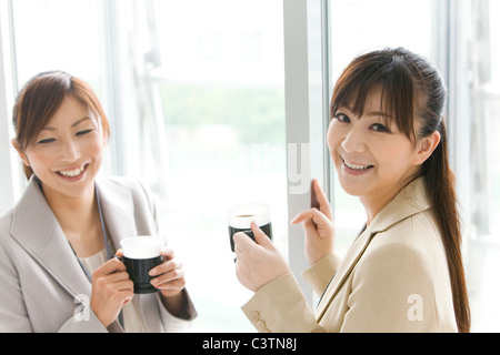 Businesswomen Having Coffee Break Stock Photo