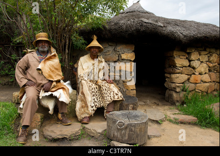 Sotho men in front of hut, Basotho Cultural Village, Golden Gate Highlands National Park, South Africa Stock Photo