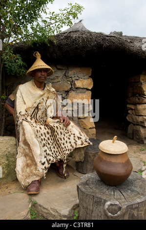 Sotho man in front of hut, Basotho Cultural Village, Golden Gate Highlands National Park, South Africa Stock Photo