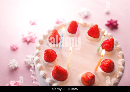 Strawberry birthday cake with candles Stock Photo - Alamy
