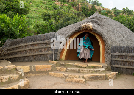 Sotho woman in front of hut, Basotho Cultural Village, Golden Gate Highlands National Park, South Africa Stock Photo