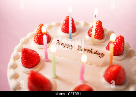 Strawberry birthday cake with candles Stock Photo - Alamy