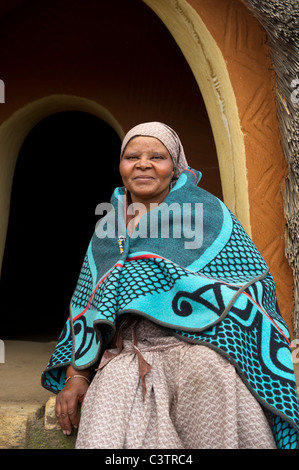 Sotho woman in front of hut, Basotho Cultural Village, Golden Gate Highlands National Park, South Africa Stock Photo