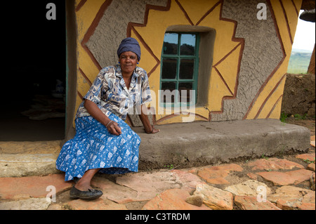 Sotho woman in front of hut, Basotho Cultural Village, Golden Gate Highlands National Park, South Africa Stock Photo