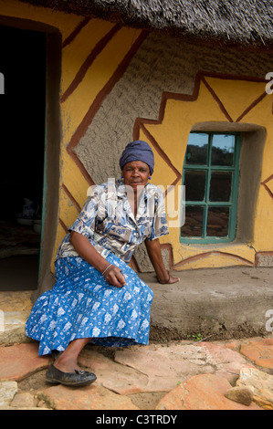 Sotho woman in front of hut, Basotho Cultural Village, Golden Gate Highlands National Park, South Africa Stock Photo